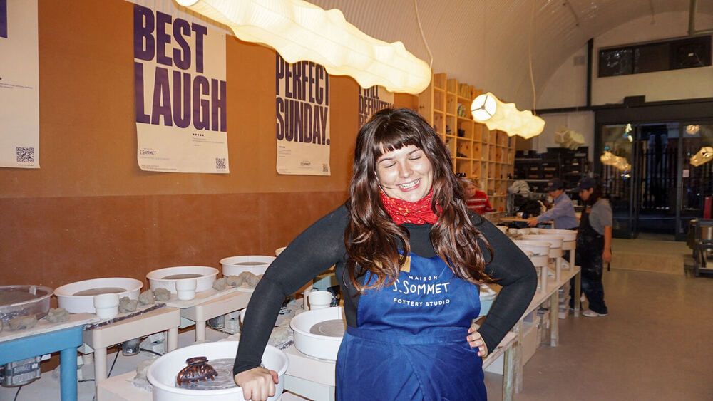 Smiling instructor in a Maison S.Sommet apron